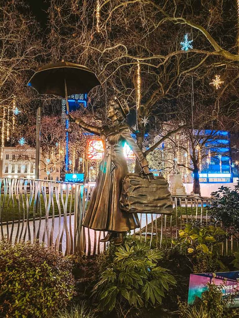Mary Poppins Statue in Leicester Square at night in London