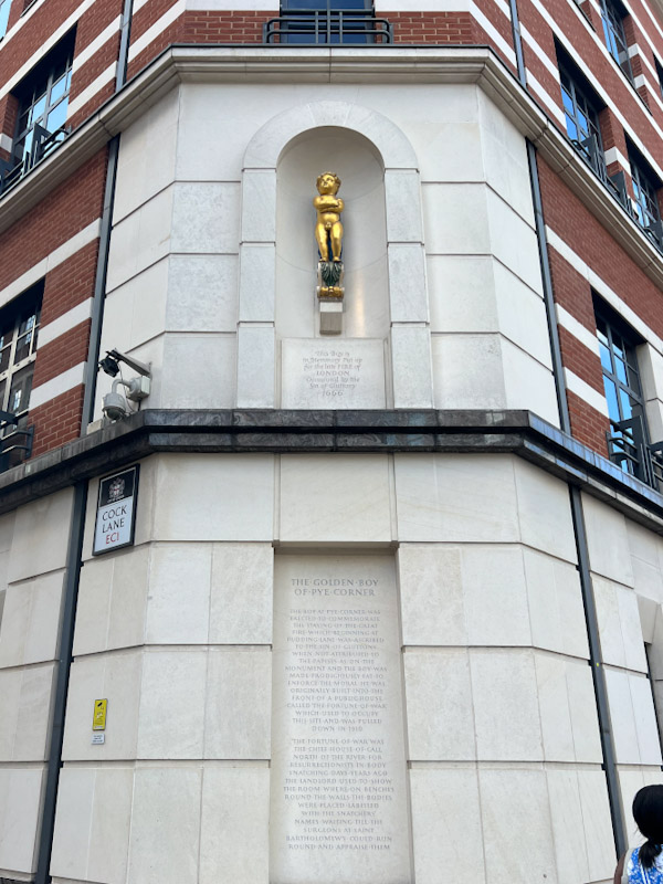 The golden boy of Pye Corner on the corner Giltspur street and Cock lane which marks where the great fire of London finished