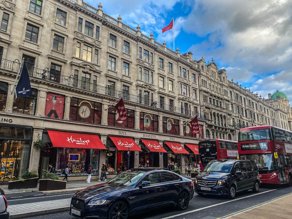 Hamleys store front in Piccadilly With buses and taxis in front